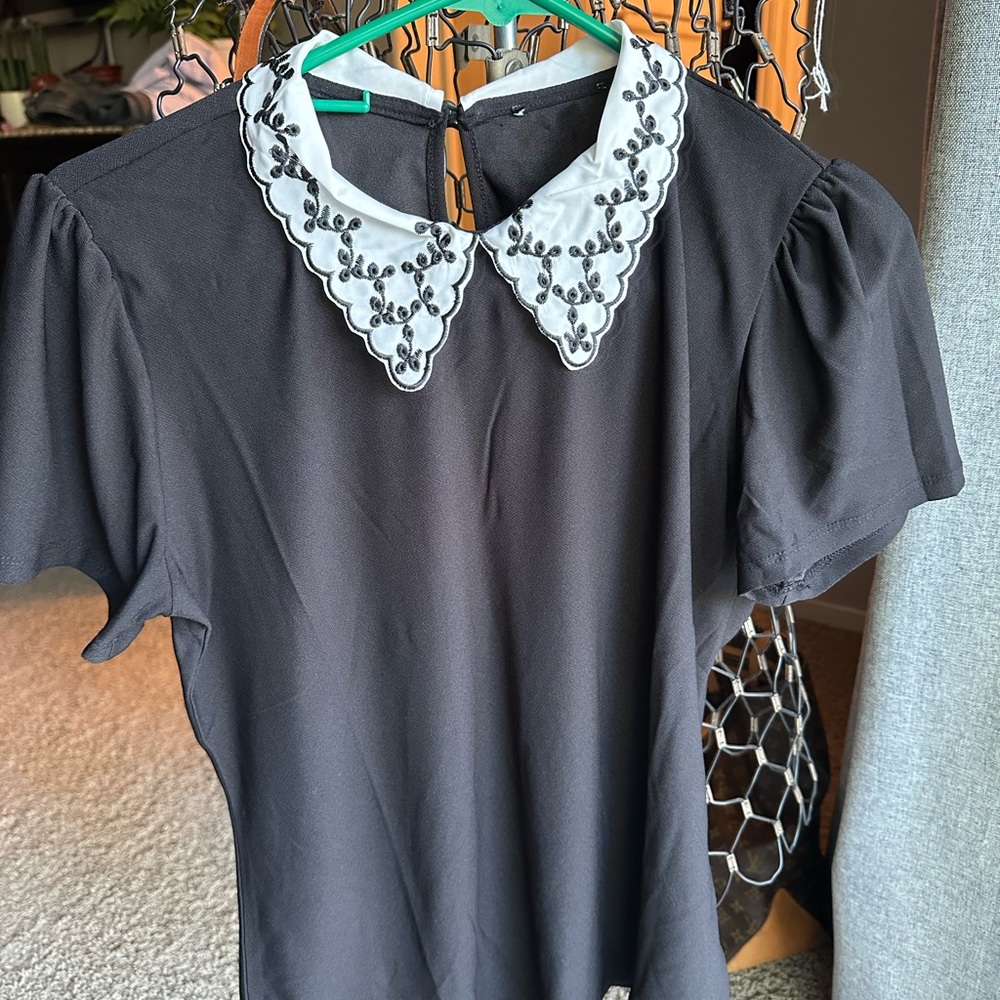 Elegant Black Top with Embroidered White Collar